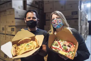  ?? Brian A. Pounds / Hearst Connecticu­t Media ?? Local restaurate­urs Amer and Michelle Lebel are manufactur­ing biodegrada­ble, waterproof takeout boxes with their new business, Kraft Green LLC, in Milford.