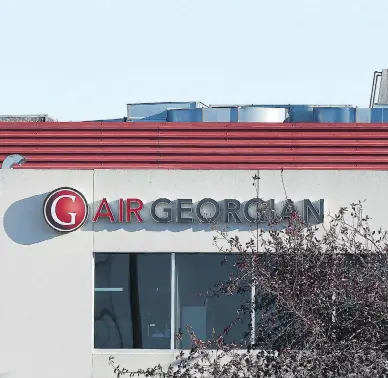  ?? PETER J THOMPSON/NATIONAL POST/FILES ?? Despite Air Georgian losing a 1.5-million passenger contract with Air Canada, the regional carrier says it does not expect the loss of the deal to negatively impact its long-term business growth.