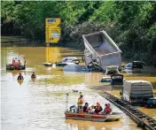  ?? SASCHA SCHUERMANN Getty Images ?? Search and rescue teams work on a flooded and damaged part of a highway Saturday in Erftstadt, Germany. The death toll in western Europe rose to at least 160 after record rainfall this week caused rivers to burst their banks, resulting in widespread devastatio­n in the region.