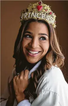  ??  ?? Leah Cast models a custom crown and a vintage tiara from the Vintage Contessa’s showroom.