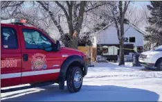  ?? CANADIAN PRESS PHOTO ?? A Davidson Fire Department vehicle is parked outside of the scene of a house fire that happened yesterday on Ottawa Street in Davidson, Sask. on Monday.