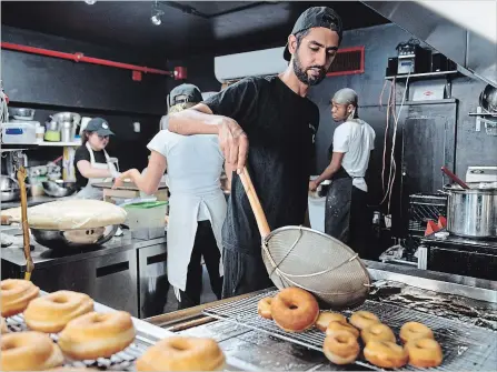  ?? GALIT RODAN THE CANADIAN PRESS ?? Jiten Grover, owner of Dipped Donuts, knew the power social media stars possess to boost the profile of a business in the food industry.