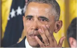  ??  ?? President Obama wipes away tears as he speaks at the White House on Tuesday about his executive actions that are intended to reduce gun violence.