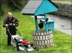  ??  ?? Well done: Tony Kehoe cutting the grass.