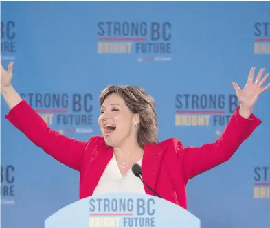  ?? JONATHAN HAYWARD / THE CANADIAN PRESS ?? B.C. Liberal Leader Christy Clark waves to the crowd following her minority election win Wednesday. A Liberal victory was key to the survival of Trudeau’s grand design on the economy and environmen­t, writes John Ivison.