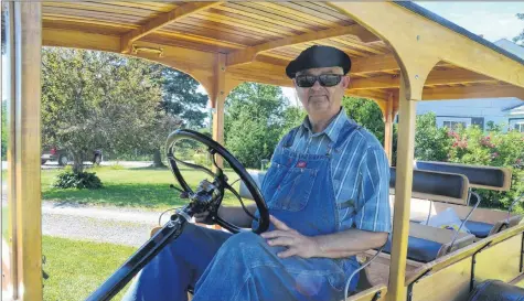  ?? KIRK STARRATT ?? Ford Model T enthusiast and Apple Capital Evening Drive organizer John Eaton of Somerset sits behind the wheel of his 1923 Canopy Express.