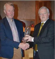  ??  ?? Marian O’Callaghan of Transeuro making a presentati­on to George Fitzgibbon, Milford, and Cork Intermedia­te camogie selector