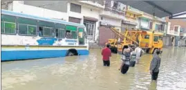  ?? MANOJ DHAKA/HT ?? A Haryana Roadways bus stuck on a waterlogge­d road in Jind on Monday. The weatherman has predicted very heavy rain with thundersto­rms in the next 24 hours.