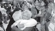  ?? Patrick Farrell/Miami Herald ?? Celia Llamo hugs her sister Amparo Llamo as she arrives at Miami Internatio­nal Airport from Cuba in 2006.