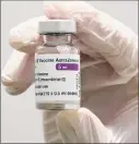 ?? Matthias Schrader / Associated Press ?? Medical staff prepares an Astrazenec­a coronaviru­s vaccine on Monday near Munich, Germany.