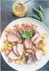  ?? GRETCHEN MCKAY/PITTSBURGH POST-GAZETTE ?? Pork roast is dusted in warm Mediterran­ean spices and glazed with homemade, spicy-sweet jalapeno jelly.