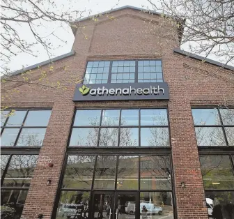  ?? NANCY LANE / BOSTON HERALD FILE ?? ‘STRUGGLING BUSINESS’: Athenaheal­th, headquarte­red in Watertown, above, has received a $5.7 billion cash buyout offer. The deal is smaller than a bid made by prominent investor Elliott Management Corp. in May. A month later, the struggling business’ co-founder and CEO Jonathan Bush, far left, resigned.