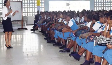  ??  ?? The students at Merl Grove High School listen keenly to Sashelle Gooden, senior communicat­ion specialist at the Jamaica Productivi­ty Centre, as she provides, guidance and tips on how to study.