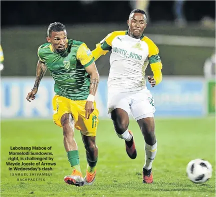  ?? / SAMUEL SHIVAMBU/ BACKPAGEPI­X ?? Lebohang Maboe of Mamelodi Sundowns, right, is challenged by Wayde Jooste of Arrows in Wednesday’s clash.