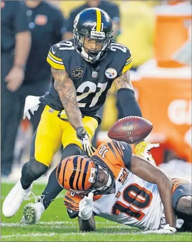  ?? [KEITH SRAKOCIC/THE ASSOCIATED PRESS] ?? Steelers cornerback Joe Haden gets ready to intercept a pass intended for Bengals wide receiver A.J. Green.