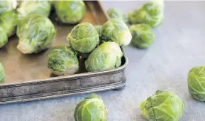  ?? MATTHEW MEAD/THE ASSOCIATED PRESS ?? Keep the stem end of Brussels sprouts in water.