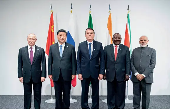  ??  ?? Chinese President Xi Jinping (2nd L) with Brazilian President Jair Bolsonaro (C), Russian President Vladimir Putin (1st L), Indian Prime Minister Narendra Modi (1st R), and South African President Cyril Ramaphosa (2nd R) following a BRICS leaders meeting on the sidelines of G20 Osaka Summit in Japan on June 28, 2019.