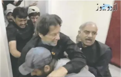  ?? URDU MEDIA VIA REUTERS ?? Former Pakistani prime minister Imran Khan is seen in a still image obtained from video after he was shot by a gunman on Thursday. Khan was in a convoy of trucks at the time and headed for a campaign event in Wazirabad district.