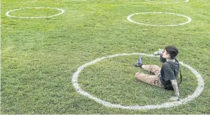  ?? NATHAN DENETTE THE CANADIAN PRESS FILE PHOTO ?? A man sips beer at Trinity Bellwoods Park on May 28. Going to a park and drinking incurs a $300 fine, “despite the fact it has no adverse effect on anyone else,” Coun. Josh Matlow said.