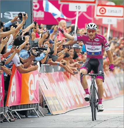  ?? Picture: AFP/LUK BENIES ?? HERO’S WELCOME: Italian rider Elia Viviani, of team Quick-Step, celebrates as he crosses the finish line to win the third stage of the 101st Giro d’Italia, 229km between Beer-Sheva and Eilat in Israel