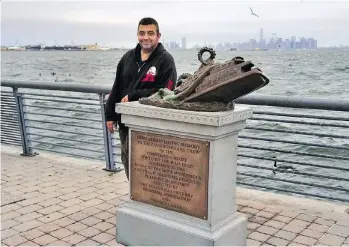  ?? ULA ILNYTZKY/ THE ASSOCIATED PRESS ?? Artist Joseph Reginella stands with the monument dedicated to the victims of the Cornelius G. Kolff ferry sinking in New York. It took Reginella six months to execute his hoax.