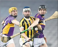  ?? Piaras Ó Mídheach/Sportsfile) (Photo: ?? St Catherines’ players, Eoin Condon (left) and Oisín Fitzgerald, look to deny Lar Murphy of Tullogher-Rosbercon during the AIB GAA Hurling All-Ireland Junior Club Championsh­ip final at Croke Park.