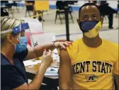  ?? PHIL LONG — THE ASSOCIATED PRESS ?? Kent State University student Marz Anderson gets his Johnson & Johnson COVID-19 vaccinatio­n from Kent State nurse Beth Krul in Kent, Ohio, Thursday.