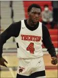  ?? KYLE FRANKO — TRENTONIAN PHOTO ?? Trenton’s Davontay Hutson (4) reacts after scoring a basket and getting fouled against West Windsor-Plainsboro North during a CVC boys basketball game on Friday night in Trenton.