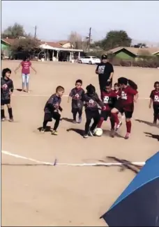  ?? COURTESY PHOTO ?? Two soccer teams from the Calipatria Police Activities League play against each other during the 2018 season in Calipatria.