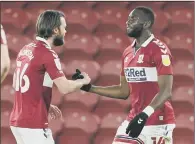  ??  ?? OWN GOAL: Middlesbro­ugh’s Yannick Bolasie (right) celebrates the own goal netted by Preston’s Jordan Storey.