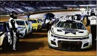  ?? Wade Payne / Associated Press ?? Cars sit on the pit road under a red flag due to rain during a NASCAR Cup Series race Sunday in Bristol, Tenn.