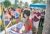  ?? JENNIFER LETT/STAFF PHOTOGRAPH­ER ?? Kailyn Bryant paints an interpreta­tion of the March for Our Lives Road to Change bus tour event in West Palm Beach.