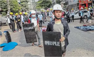  ?? THE ASSOCIATED PRESS ?? Demonstrat­ors in Myanmar took to the streets in Yangon again on Wednesday to protest last month’s seizure of power by the military.