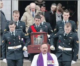  ??  FRED CHARTRAND/ THE CANADIAN PRESS ?? Followed by mourners, pall bearers carry the urn of Sgt. Andrew Doiron out of the Notre-Dame Basilica during a funeral in Ottawa on Saturday.