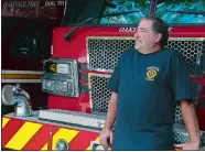  ?? SARAH GORDON/THE DAY ?? Oakdale Fire Chief Gary Murphy leans on one of the department’s trucks in the garage last Thursday.