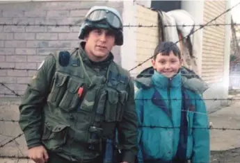  ?? COURTESY JUSTIN FRYE ?? Justin Frye, left, bonded with Amir Bagramovic in Bosnia in 1994. Social media has helped facilitate their reunion.