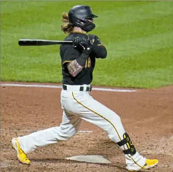  ?? Associated Press ?? Pirates outfielder Ben Gamel follows through on a two-run single off Detroit Tigers relief pitcher Alex Lange Tuesday.