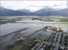  ?? AP photo / Jonathan Hayward, The Canadian Press ?? Floodwater­s are seen in Chilliwack, British Columbia on Tuesday.