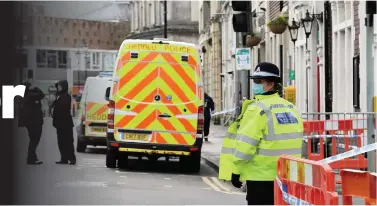  ?? Picture: Gayle Marsh ?? Police at the scene of an assault on Windsor Road, Neath. The town centre was closed off for a while as emergency services dealt with the incident.