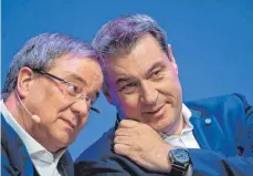 ?? FOTO: GUIDO KIRCHNER/DPA ?? Zwei mögliche Kanzlerkan­didaten: Armin Laschet (CDU, li.), NRW-Ministerpr­äsident, und Bayerns Ministerpr­äsident Markus Söder (CSU).