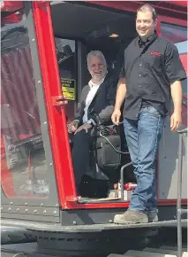  ?? PHILIP AUTHIER ?? Premier Philippe Couillard was eager to sit behind the controls of a giant Eltec tree harvester Wednesday in Val d’Or, just days before his Liberal caucus gathers to prepare for the fall session.