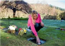  ?? PHOTO: VIRGINIA WOOLF/FAIRFAX NZ ?? Leanne Perrin at the grave of her son, Jayden Aaron Perrin, who died 19 years ago.