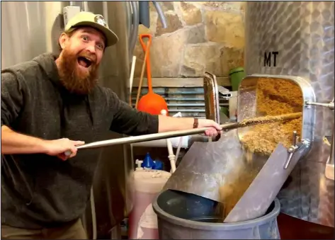  ?? PROVIDED BY ALAN SIMONS ?? Alan Simons of Live Slow Brewing mugs for the camera while graining out at Telluride Brewing for a beer that was brewed for Collaborat­ion Fest in 2023.