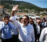  ?? (Yiorgos Kontarinis/Eurokiniss­i via Reuters) ?? GREEK PRIME Minister Alexis Tsipras greets supporters yesterday on the island of Ithaca, Greece.