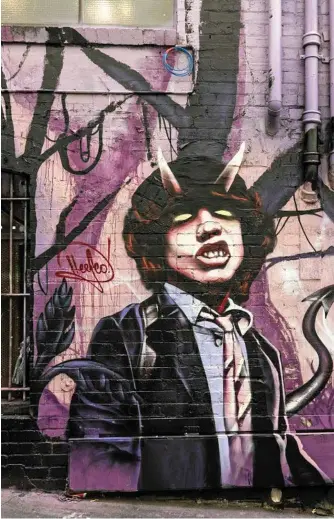  ?? Photo: Visit Victoria ?? BACK IN BLACK: Melbourne’s AC/DC Lane will leave you “thunderstr­uck”.