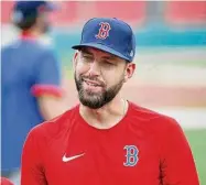  ?? Michael Dwyer/Associated Press ?? The Boston Red Sox’s Matt Barnes talks with a teammate during practice at Fenway Park in Boston on July 3, 2020.