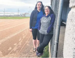  ?? KRYSTA CARROLL ?? President of the Grand Falls-Windsor Co-ed Softball League Hannah Russell, left, and Slo Pitch National Central representa­tive Mary Folkes are excited for a busy season of softball in Grand Falls-Windsor.