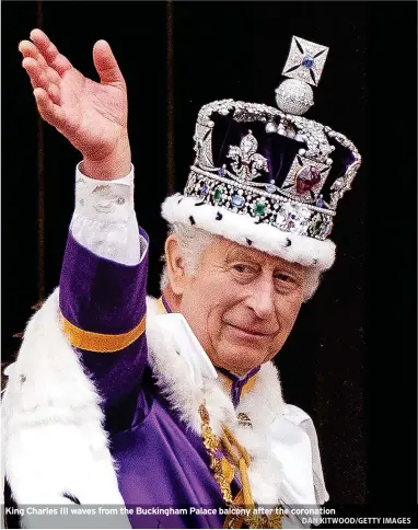  ?? DAN KITWOOD/GETTY IMAGES ?? King Charles III waves from the Buckingham Palace balcony after the coronation