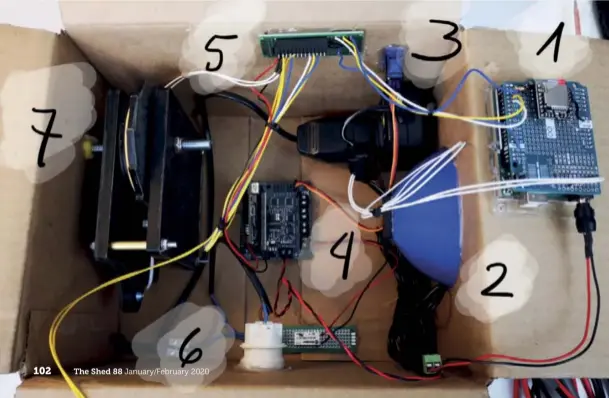  ??  ?? Below: The music box before closing the container with all the components:
1. Arduino MP3 player
2. Smartphone-sized speaker with the 3D-printed blue cone to amplify the sound
3. Servo connected externally to the charger arrow of the box
4. Micro Bit plugged in the robotic Kitronik box
5. Printed circuit board (PCB) wiring the digital control signals
6. Relays and 220V lamp group
7. Ratchet module with the DC generator connected to the spring-charger simulator