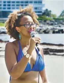  ?? SCOTT LUXOR/CONTRIBUTO­R PHOTOS ?? Nerissa Street holds a Juneteenth mindfulnes­s event at Dania Beach.